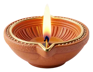 A lit clay oil lamp with a warm flame.